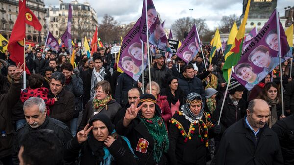 Kurdish demonstrators protest on the third anniversary of the killing of three Kurdish activists, in Paris, France, Saturday, Jan. 9, 2015. - Sputnik International