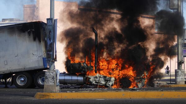 A truck burns on a street in Culiacan, Sinaloa state, Thursday Jan. 5, 2023, as Mexican security forces captured Ovidio Guzmán, an alleged drug trafficker wanted by the United States. - Sputnik International