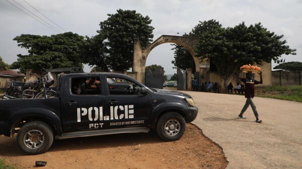 A police truck is stationed outside the University of Abuja Staff Quarters gate where unknown gunmen kidnapped people amongst whom were 2 of the university professors, lecturers and their family members in Abuja, Nigeria on November 2, 2021. - Sputnik International