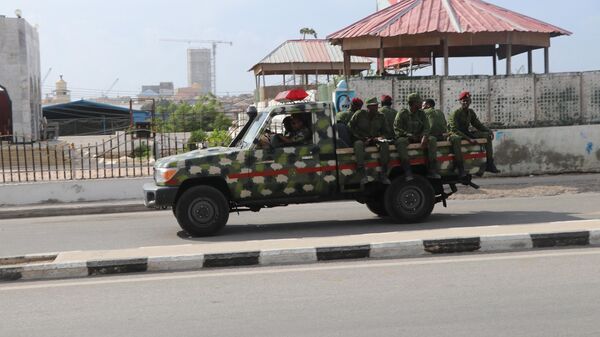Somali government soldiers on a military vehicle are seen outside the SYL hotel in Mogadishu on December 11, 2019 - Sputnik International