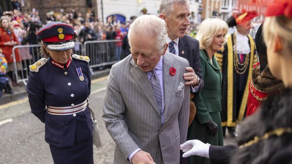 King Charles III reacts after an egg was thrown his direction as he arrived for a ceremony at Micklegate Bar in York - Sputnik International