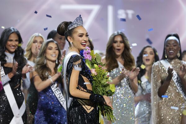 At 28, Gabrielle designs sustainable clothing, runs a fashion line under her name, and works as a model and “sewing instructor” at a non-profit tailor shop.Above: Miss USA R&#x27;Bonney Gabriel poses after being crowned Miss Universe at the 71st Miss Universe pageant.  - Sputnik International