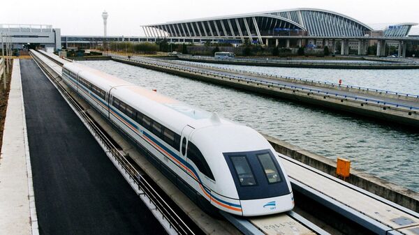 The world's first commercial levitation train or maglev leaving Shanghai's Pudong International Airport for a trial run to Shanghai city's new Pudong financial district in China - Sputnik International