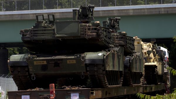 Abrams tanks are seen on a flat car in a rail yard, Tuesday, July 2, 2019, in Washington. - Sputnik International
