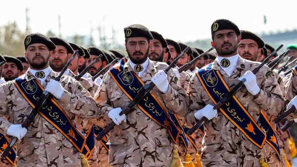Members of Iran's Revolutionary Guards Corps (IRGC) march during the annual military parade - Sputnik International