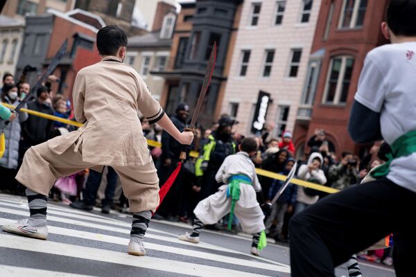 Participants perform during the Lunar New Year Parade in the Chinatown neighborhood of Washington, DC, on 22 January 2023. - Sputnik International
