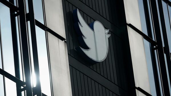 A Twitter logo hangs outside the company's offices in San Francisco, on Dec. 19, 2022. - Sputnik International