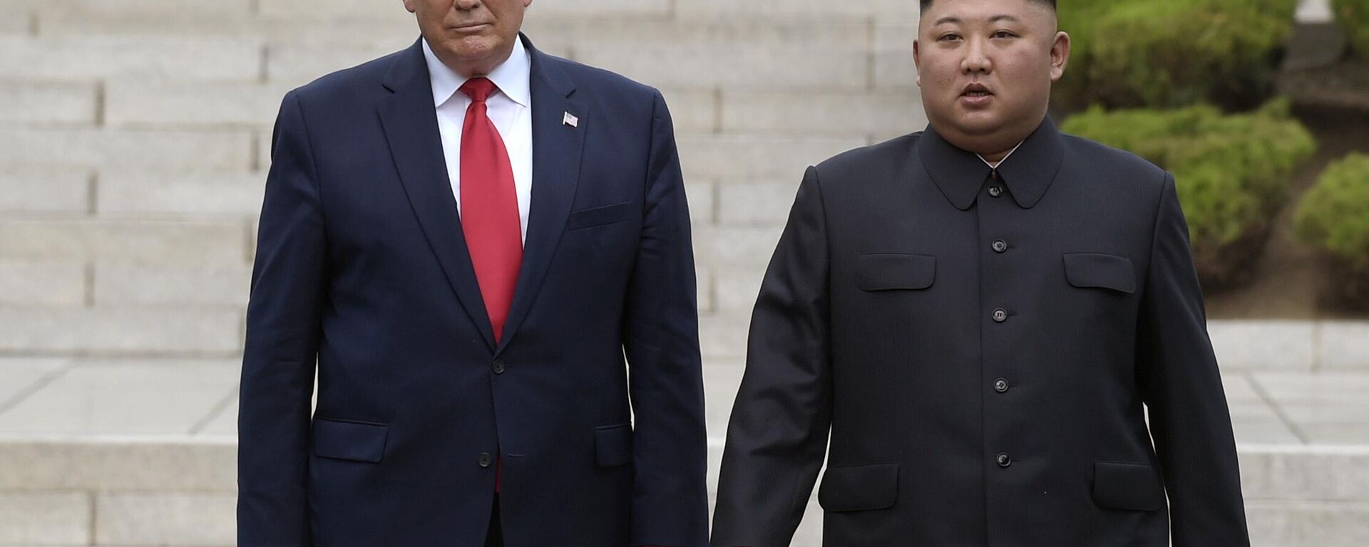 Then US President Donald Trump, left, meets with North Korean leader Kim Jong-Un at the North Korean side of the border at the village of Panmunjom in Demilitarized Zone, on June 30, 2019. - Sputnik International, 1920, 25.10.2025