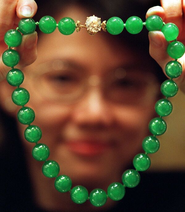 The most ancient piece of jewelry is a necklace of clamshells found in Morocco. It is at least 110,000 years old.Above: A gem expert displays the exceptional &#x27;Doubly Fortunate&#x27; jadeite necklace which was auctioned by Christie&#x27;s Hong Kong. It is considered the most important piece of jadeite jewelry ever to appear at an auction and was worth approximately $4Mln. - Sputnik International