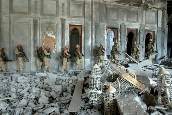US Army soldiers from A Company, 3rd Battalion, 7th Infantry Regiment search a presidential palace in Baghdad, Tuesday, April 8, 2003. The palace was the second they had secured in as many days, both lavish buildings heavily damaged by previous Air Force bombing. - Sputnik International