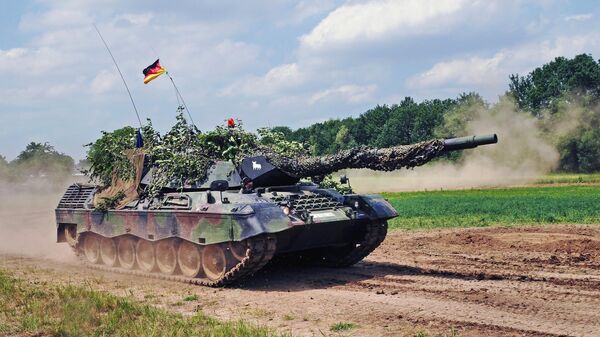 A German Leopard 1A5 tank drives past at the at the 2015 military day in Uffenheim, Germany - Sputnik International