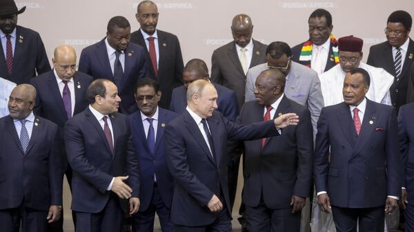 Russian President Vladimir Putin, center, gestures while posing for a photo with leaders of African countries at the Russia-Africa summit in the Black Sea resort of Sochi, Russia, Thursday, Oct. 24, 2019. - Sputnik International