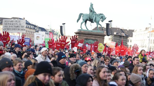 Protesters gather on Christiansborg Square in front of the Danish Parliament in Copenhagen, Denmark, during a demonstration on February 5, 2023 against the abolishment of a public holiday in order to finance the country's defense budget.  - Sputnik International