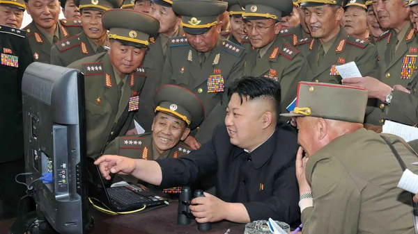 North Korean leader Kim Jong-un with army officers at a computer. File photo. - Sputnik International