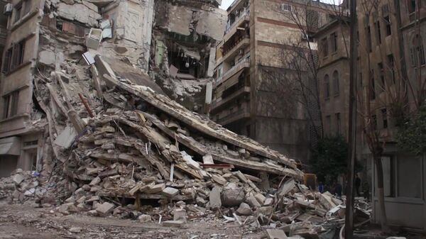 A residential building destroyed by a magnitude 7.8 earthquake that occurred on February 6 is seen in Aleppo, Syria - Sputnik International