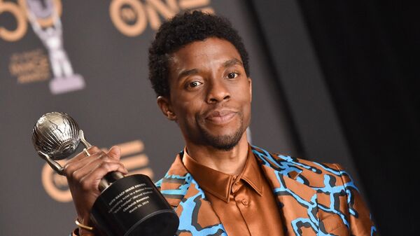Outstanding Actor in a Motion Picture for Black Panther Chadwick Boseman poses with his award in the press room during the 50th NAACP Image awards at the Dolby theatre on March 30, 2019 in Los Angeles. - Sputnik International