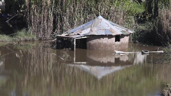 A home is submerged in flood waters near Durban, South Africa, Monday, May 23, 2022 - Sputnik International