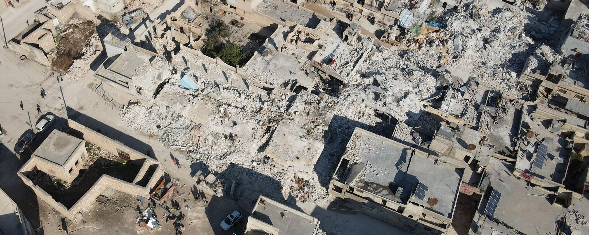 An aerial view shows collapsed buildings following last week's earthquake in Syria's rebel-held village of Atarib, in the northwestern Aleppo province, on February 14, 2023. - Sputnik International, 1920, 15.02.2023
