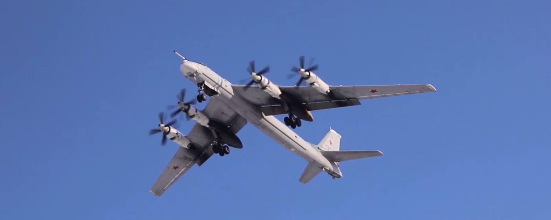 Tu-95MS bomber on patrol in the Russian Far East, Wednesday, February 15, 2023. Screengrab of Russian Defense Ministry video. - Sputnik International, 1920, 15.02.2023