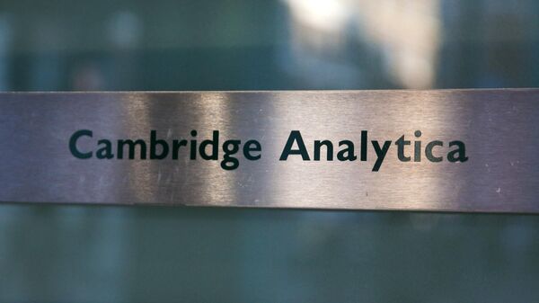 A Cambridge Analytica sign is pictured at the entrance of the building which houses the offices of Cambridge Analytica, in central London on March 21, 2018 - Sputnik International