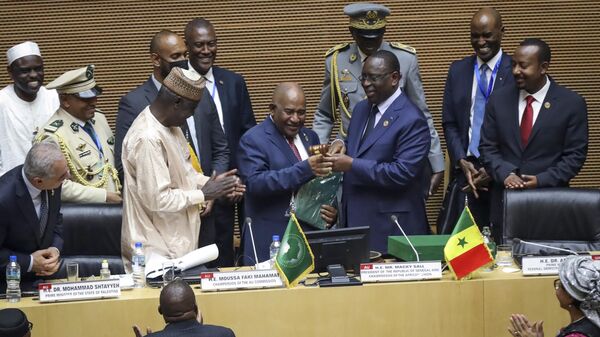 From left, Palestinian Prime Minister Mohammad Shtayyeh, African Union Commission Chairman Moussa Faki Mahamat, Comoros President Azali Assoumani, Senegal President Macky Sall, and Ethiopia President Abiy Ahmed, attend the ceremony to appoint Assoumani as the new African Union (AU) chairperson, in Addis Ababa, Ethiopia Saturday, Feb. 18, 2023. The 36th African Union Summit is taking place in the Ethiopian capital this weekend. (AP Photo) - Sputnik International