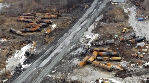 This photo taken with a drone shows the continuing cleanup of portions of a Norfolk Southern freight train that derailed  in East Palestine, Ohio.(AP Photo/Gene J. Puskar) - Sputnik International