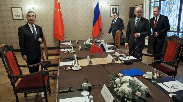 Russian Security Council Secretary Nikolai Patrushev meets with State Counselor Wang Yi of China in Moscow. Tuesday, February 21, 2023. - Sputnik International