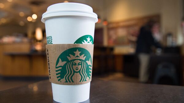 A Starbucks coffee cup is seen inside a Starbucks Coffee shop in Washington, DC, April 17, 2018,  - Sputnik International