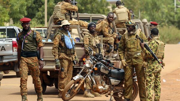 Soldiers loyal to Burkina Faso's latest coup leader Capt. Ibrahim Traore gather outside the National Assembly as Traore was appointed Burkina Faso's transitional president in Ouagadougou, Burkina Faso, Friday Oct. 14, 2022. - Sputnik International