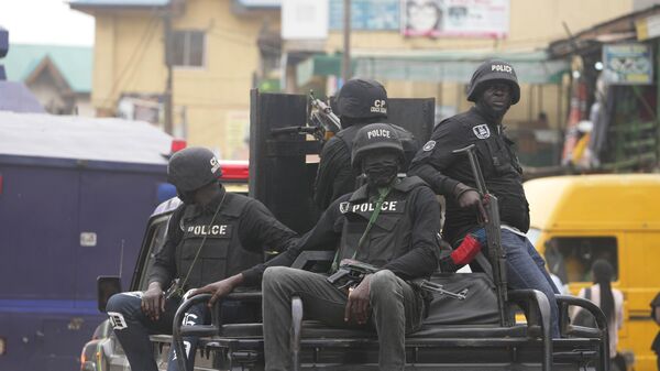 Police officers patrol during a protest by Nigeria Labour Congress on the street in Lagos, Nigeria, on July 26, 2022. - Sputnik International