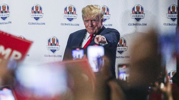 Former US President Donald Trump gestures to supporters during Trump's President Day event at the Hilton Palm Beach Airport in West Palm Beach, Florida, on February 20, 2023 - Sputnik International