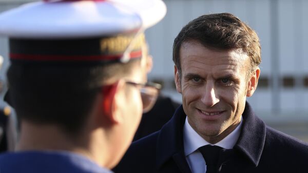 French President Emmanuel Macron smiles to a navy soldier as he visits the Mont-de-Marsan air base, southwestern, Friday, Jan. 20, 2023, France. - Sputnik International
