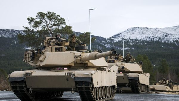US Marines drive an M1 Abrams as part of the Trident Juncture 2018 NATO-led military exercise on November 1, 2018. - Sputnik International
