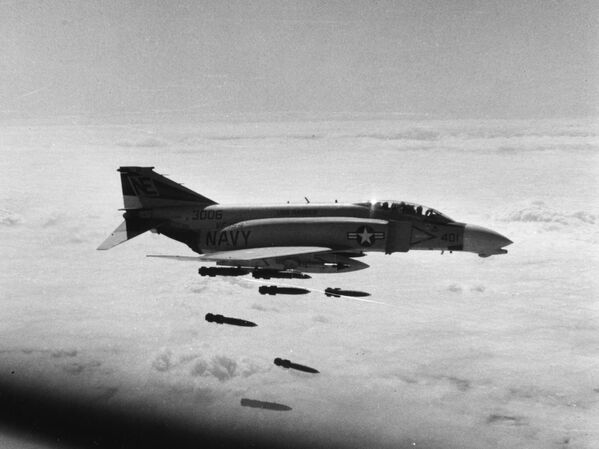 A US Navy McDonnell F-4B-26-MC Phantom II (BuNo 153006) from Fighter Squadron 154 (VF-154) &quot;Black Knights&quot; drops Mark 82 227 kg bombs on an artillery site north of the demilitarized zone in Vietnam, in support of the U.S. 3rd Marine Division, February 1968. The pilot was Lieutenant Junior Grade J. Quaintance, RIO was Lieutenant Junior Grade John H. Kelley. VF-154 was assigned to Attack Carrier Air Wing 2 (CVW-2) aboard the aircraft carrier USS Ranger (CVA-61) for a deployment to Vietnam from November 4, 1967 to May 25, 1968. - Sputnik International