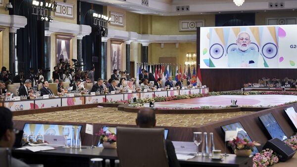 India's Prime Minister Narendra Modi, seen on screen, addresses the G20 foreign ministers' meeting in New Delhi Thursday, March 2, 2023 - Sputnik International