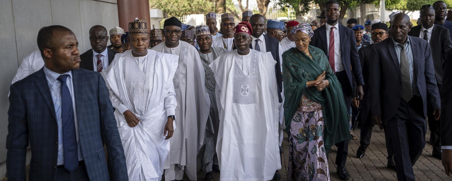 President-Elect Bola Tinubu, center, walks with his wife Oluremi Tinubu, center right, to receive his certificate at a ceremony in Abuja, Nigeria, Wednesday, March 1, 2023. Election officials declared Tinubu the winner of Nigeria's presidential election Wednesday, keeping the ruling party in power in Africa's most populous nation. - Sputnik International, 1920, 02.03.2023