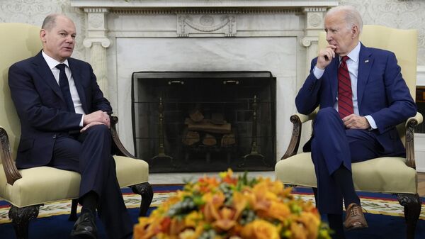 President Joe Biden listens as German Chancellor Olaf Scholz speaks during a meeting in the Oval Office of the White House in Washington, Friday, March 3, 2023. - Sputnik International