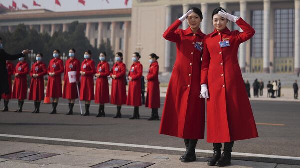 Bus hostesses pose for photos outside the Great Hall of the People - Sputnik International