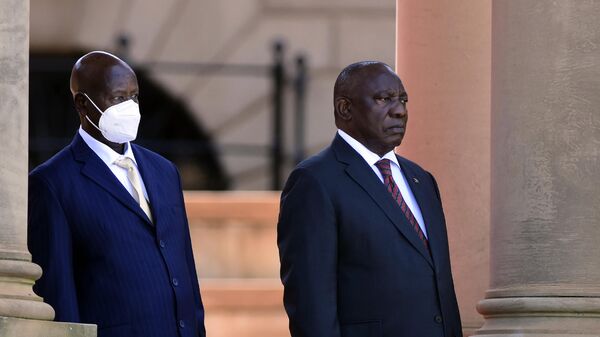 Ugandan President Yoweri Museveni, left, and his South African counterpart Cyril Ramaphosa, look on during a welcoming ceremony in Pretoria, South Africa, Tuesday, Feb. 28, 2023 - Sputnik International