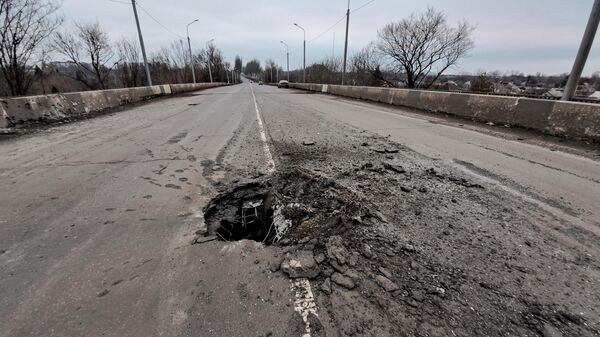 A hole is seen in the bridge's roadway after a recent shelling by Ukrainian Armed Forces in the course of Russia's military operation in Ukraine, in Donetsk - Sputnik International