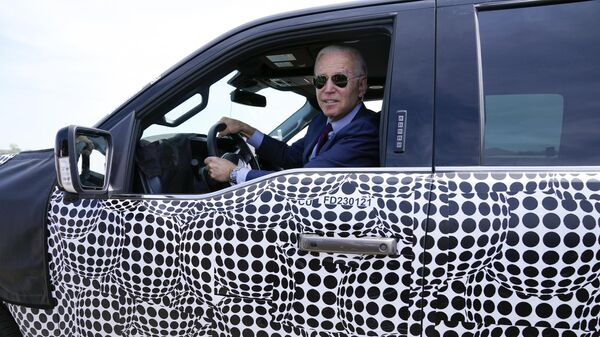 President Joe Biden stops to talk to the media as he drives a Ford F-150 Lightning truck at Ford Dearborn Development Center, May 18, 2021, in Dearborn, Mich. - Sputnik International