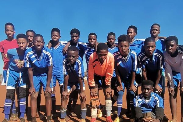 Members of the Bongoe Sport Academy, a children&#x27;s football team which is part of the Angel Pooe Foundation, pose for a group photo during training. - Sputnik International