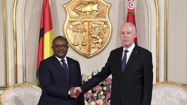 Tunisian President Kais Saied, right, shakes hands with President of Guinea-Bissau Umaro Sissoco Embalo before a meeting in Carthage, near Tunis, Tunisia, Wednesday, March 8, 2023 - Sputnik International