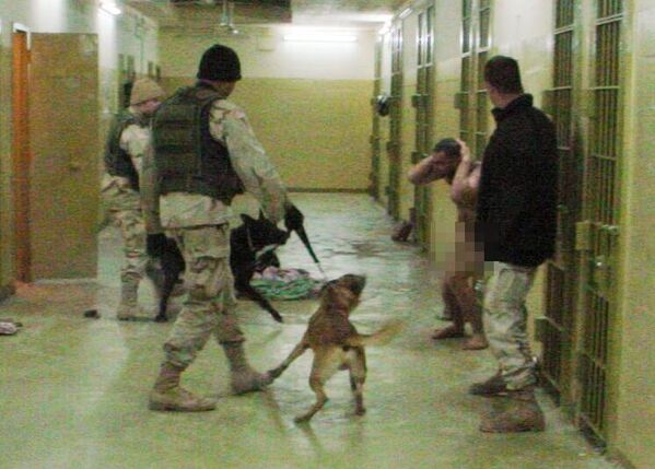 American soldiers bully Iraqi prisoners of war with dogs. This was a deliberate choice since dogs are considered impure animals in Islam and Muslims are advised to avoid contact with them. It was a special psychological tactic of humiliation.  - Sputnik International