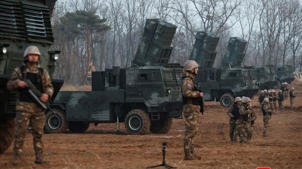 Transporter-erector-launchers (TELs) for North Korean rocket artillery, preparing to fire short-range ballistic missiles in a live-fire drill - Sputnik International