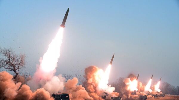 North Korean rocket artillery fire a volley of short-range ballistic missiles in a drill - Sputnik International