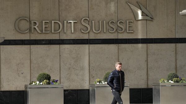 A man walks past the Credit Suisse bank headquarters in London, Thursday, March 16, 2023 - Sputnik International