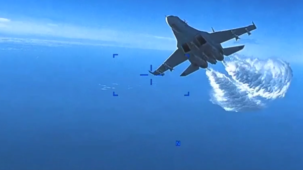Screengrab of Pentagon video on a US Reaper drone's encounter with a Russian Su-27 fighter jet over the Black Sea. - Sputnik International