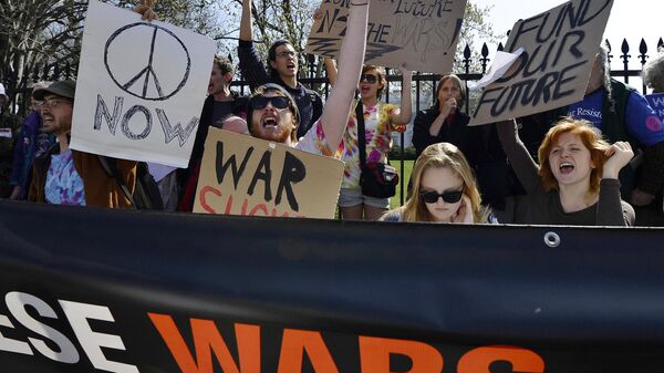Anti-war protesters take part in a demonstration in front of the White House in Washington, DC, on March 19, 2011. - Sputnik International