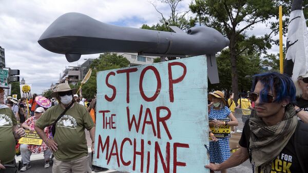 Anti-war demonstrators hold a mock drone as they rally during the Poor People's Campaign, Moral March on Pennsylvania Avenue in Washington, Saturday, June 18, 2022. - Sputnik International